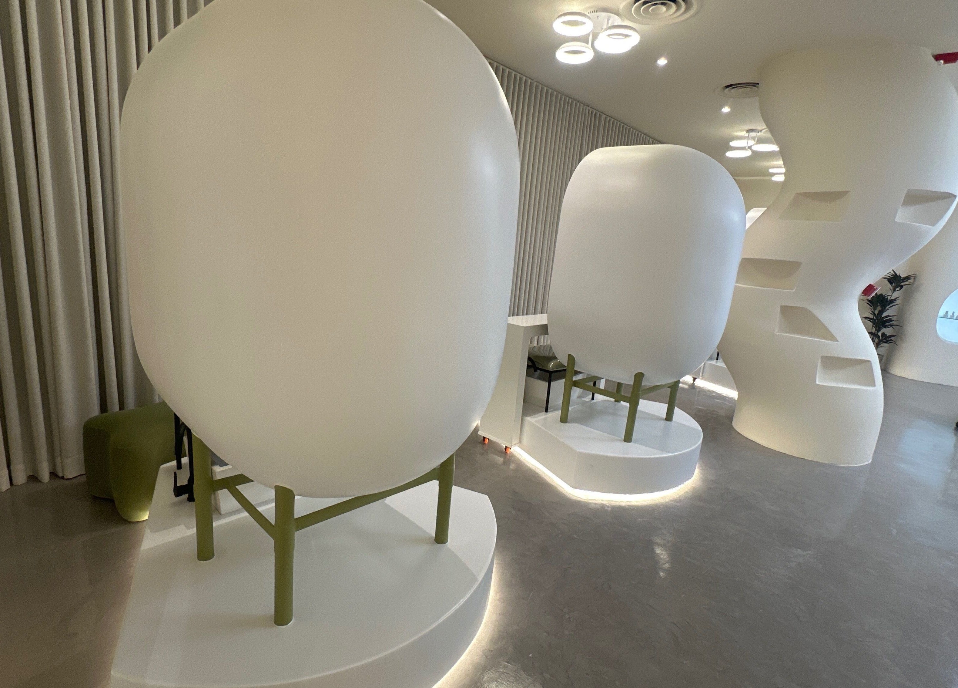 Chic pod seating at Spoiled Nail Studio, Riyadh, Riyadh Province, SA enhances the luxurious ambiance.