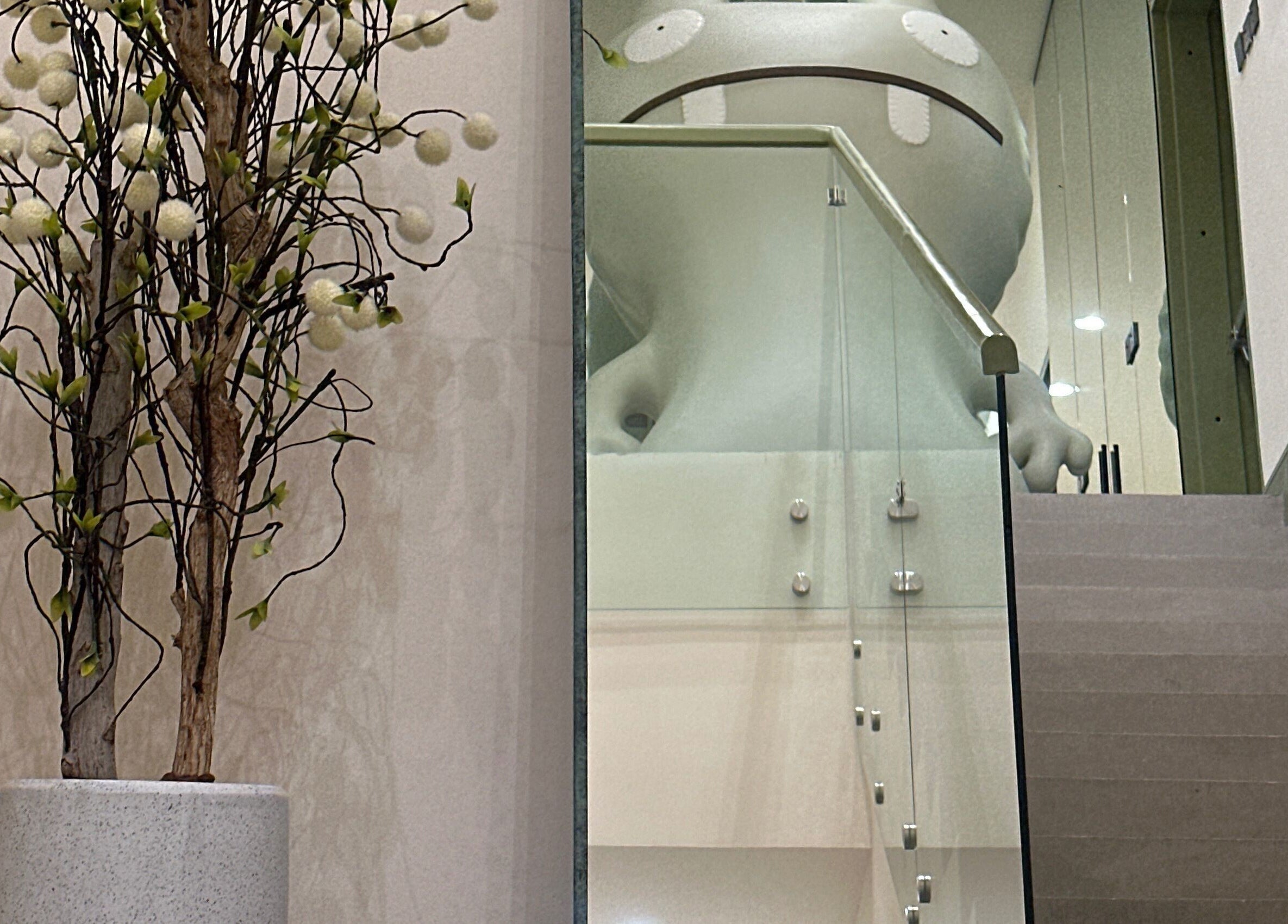 Elegant interior stairway at Spoiled Nail Studio, Riyadh, Riyadh Province, SA with artistic decor.