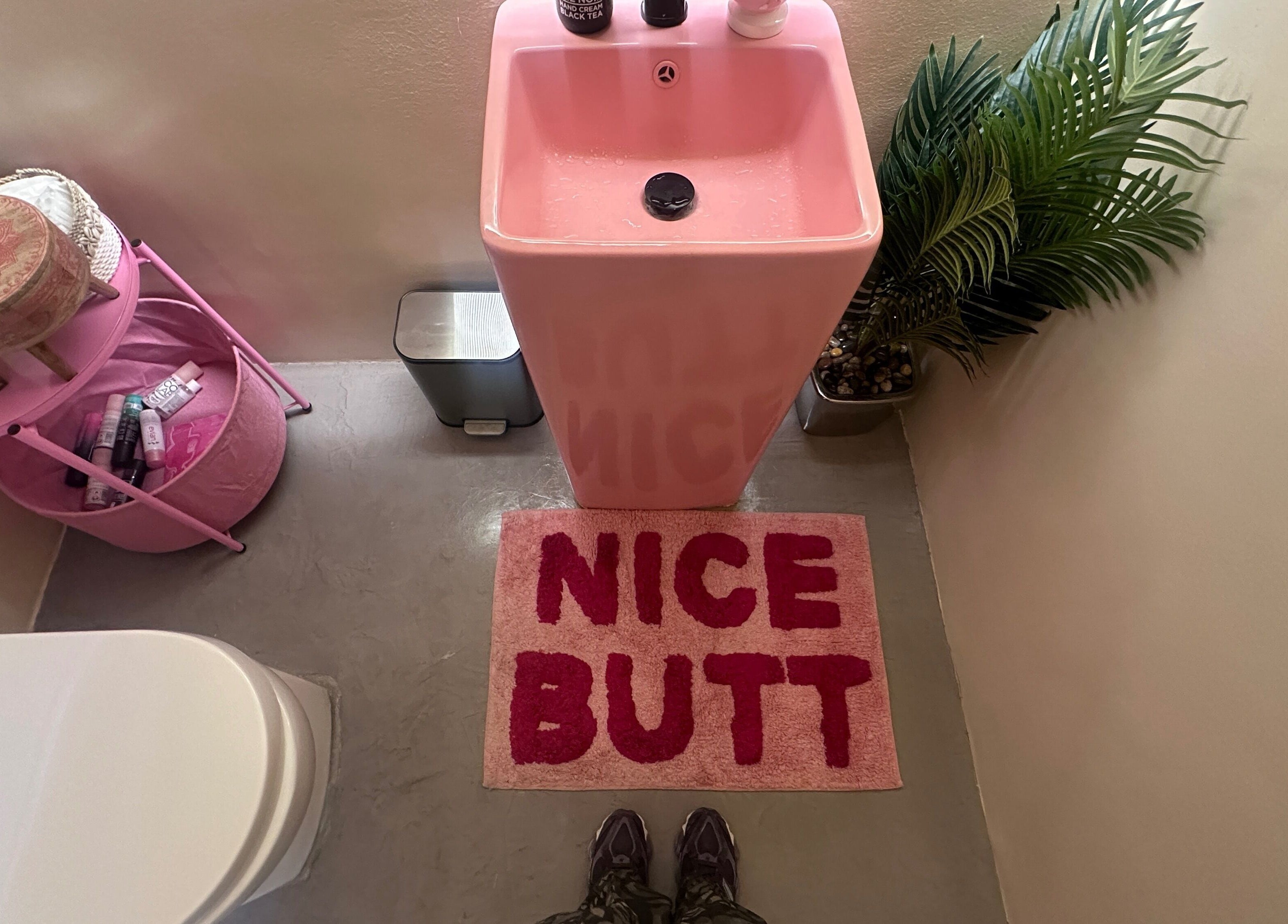 Stylish pink restroom at Spoiled Nail Studio, Riyadh with unique decor and personalized touches.