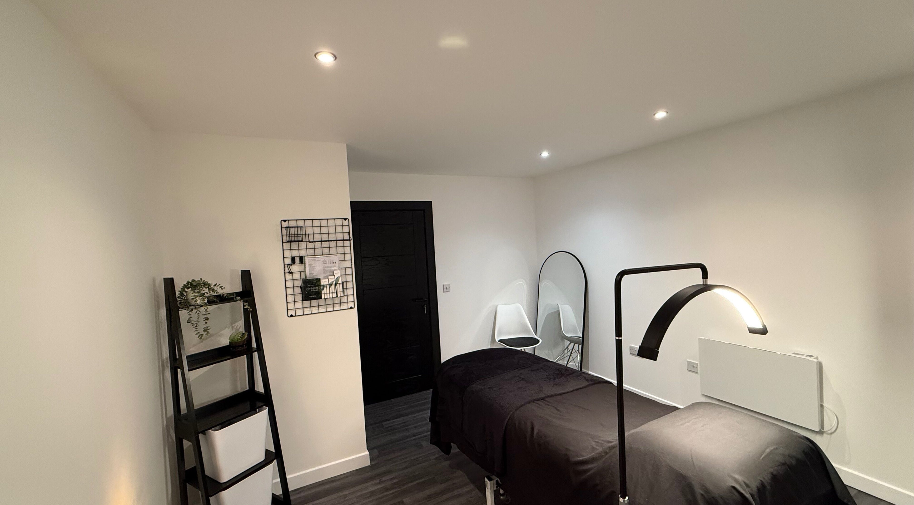 Elegant treatment room at Afterglow by KC in Coatbridge, Scotland, GB with modern decor and soothing ambiance.