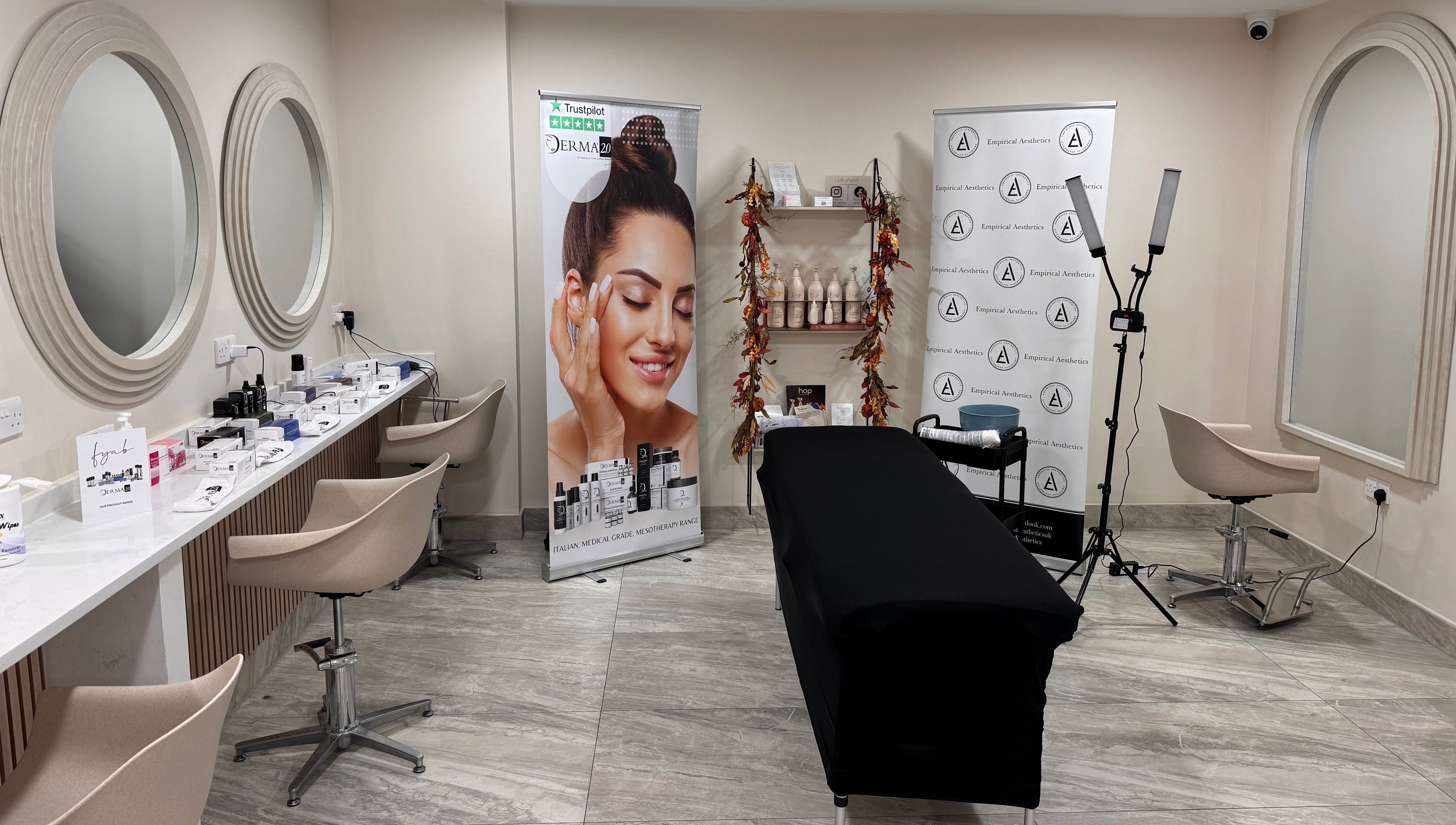 Interior of Empirical Aesthetics in St Helens, England, featuring a modern treatment room setup.