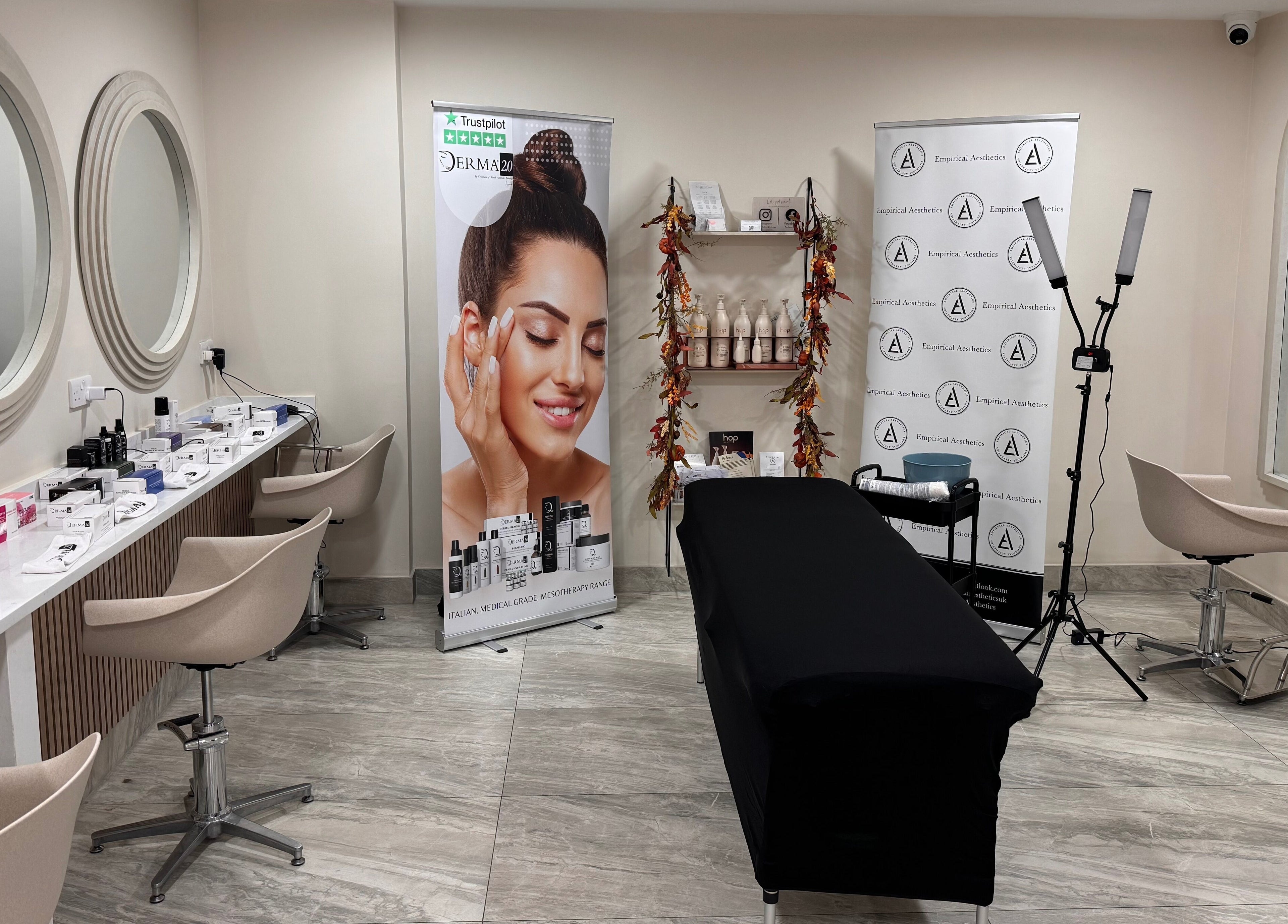 Interior of Empirical Aesthetics in St Helens, England, featuring a modern treatment room setup.