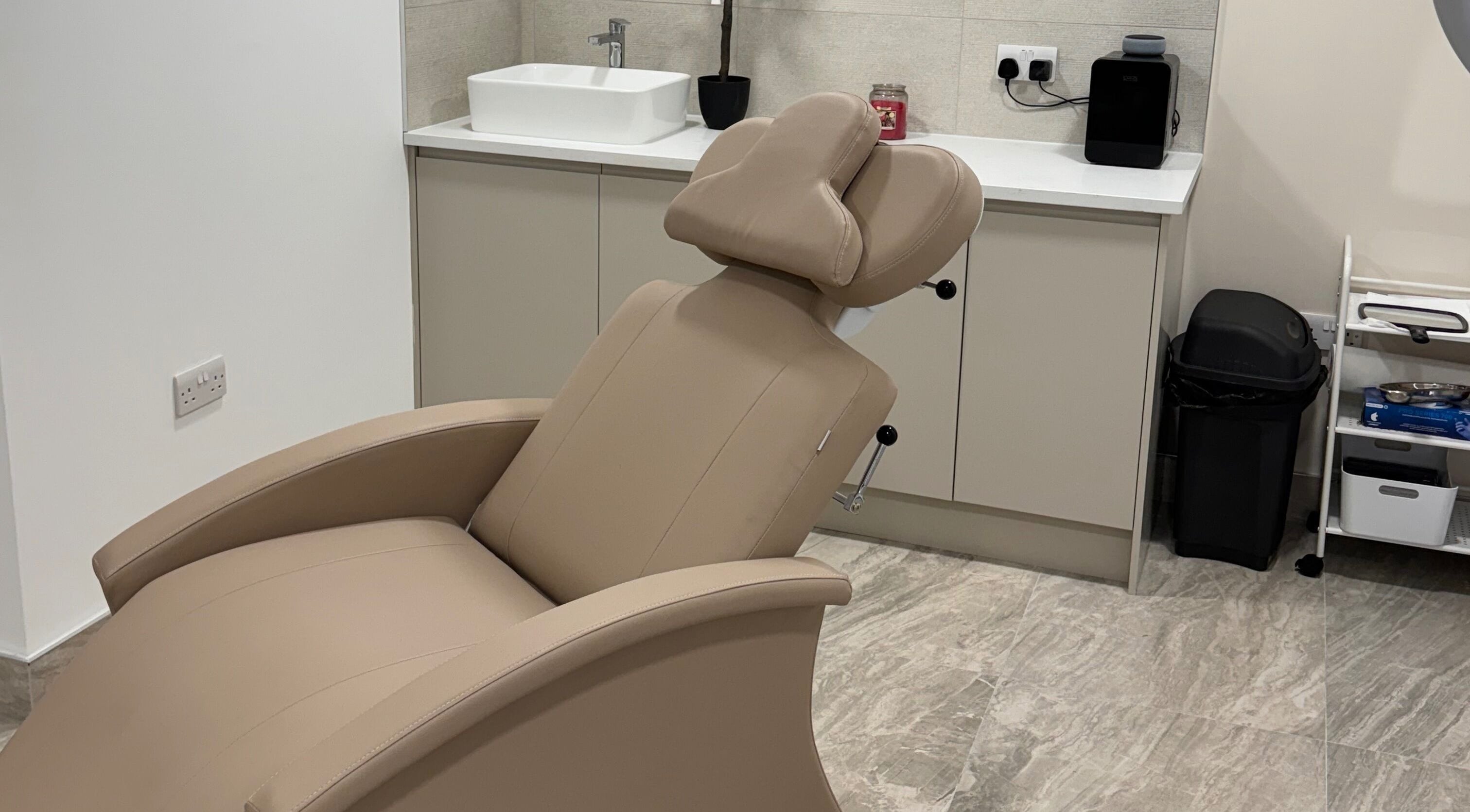 Luxury treatment chair at Empirical Aesthetics, St Helens, England, GB, offering ultimate comfort.