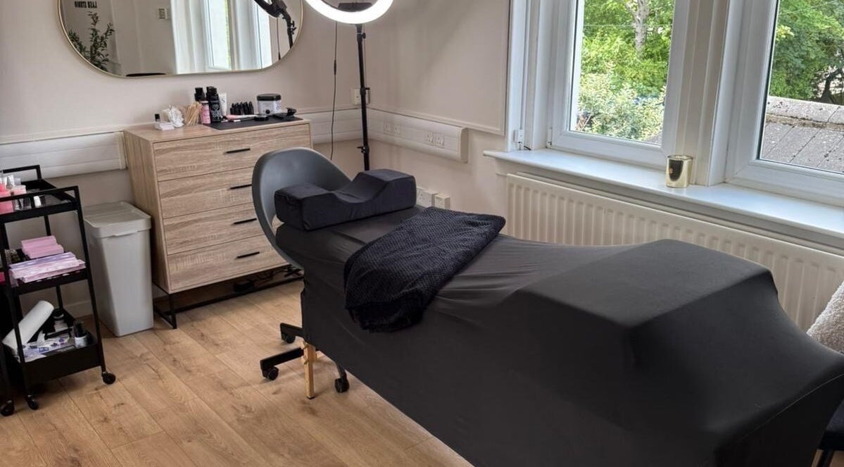 Relaxing lash treatment room at KMW Lashes, Bathgate, Scotland, GB with modern decor and large window views.