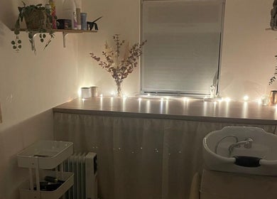 Tranquil salon space at Hair by Natalie Blake in Kilndown, England, GB, featuring soft lighting and a wash basin.