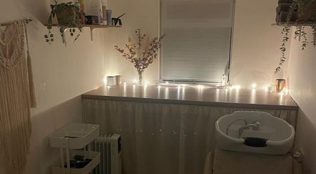 Tranquil salon space at Hair by Natalie Blake in Kilndown, England, GB, featuring soft lighting and a wash basin.