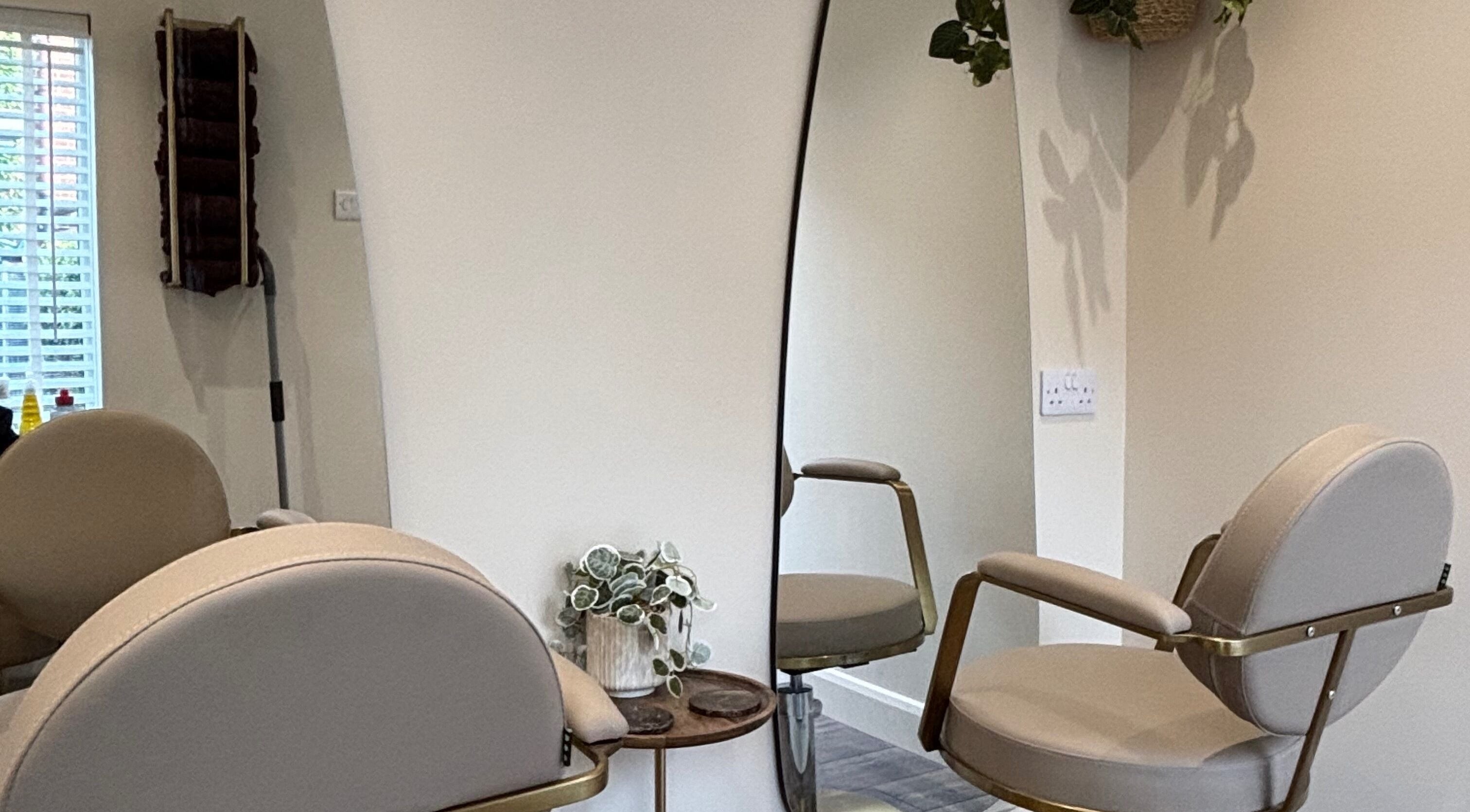 Luxurious salon chair and mirror at Studio G. in Gateshead, England, GB, offering a chic beauty experience.