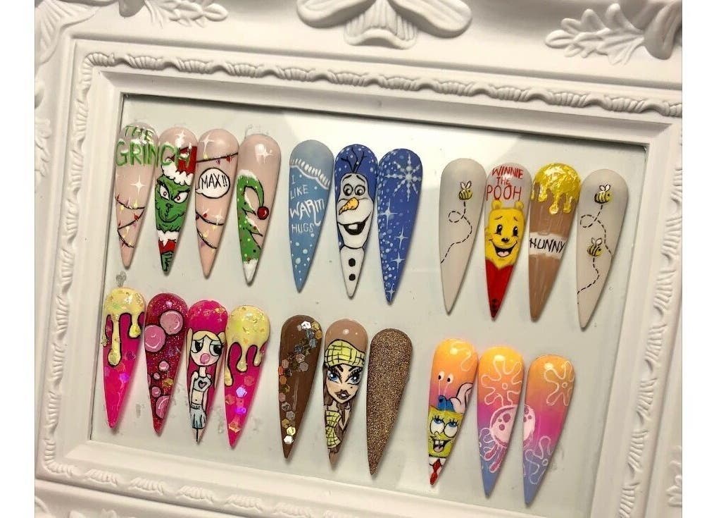 Colorful cartoon nail art at The Beauty Room Vicky, Birmingham, England, GB, showcasing creative designs.