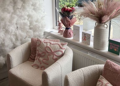 Inviting lounge area at Beauty by Ella Neal, Burnley, England, GB. Features plush chairs and decor.