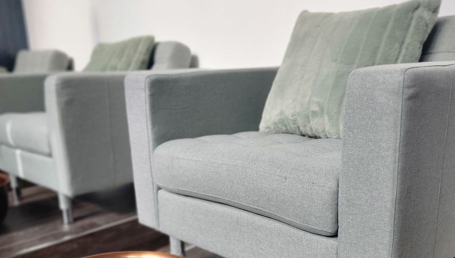 Stylish grey seating at Formation Beauty Lounge, Vancouver, British Columbia, CA, enhancing relaxation ambiance.