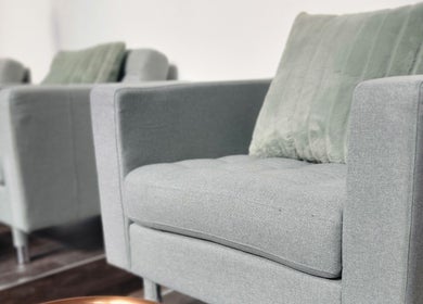 Stylish grey seating at Formation Beauty Lounge, Vancouver, British Columbia, CA, enhancing relaxation ambiance.