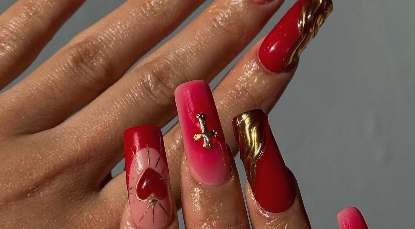 Bold red nail art with gold accents at Fampy Nails, Montréal, Québec, CA.