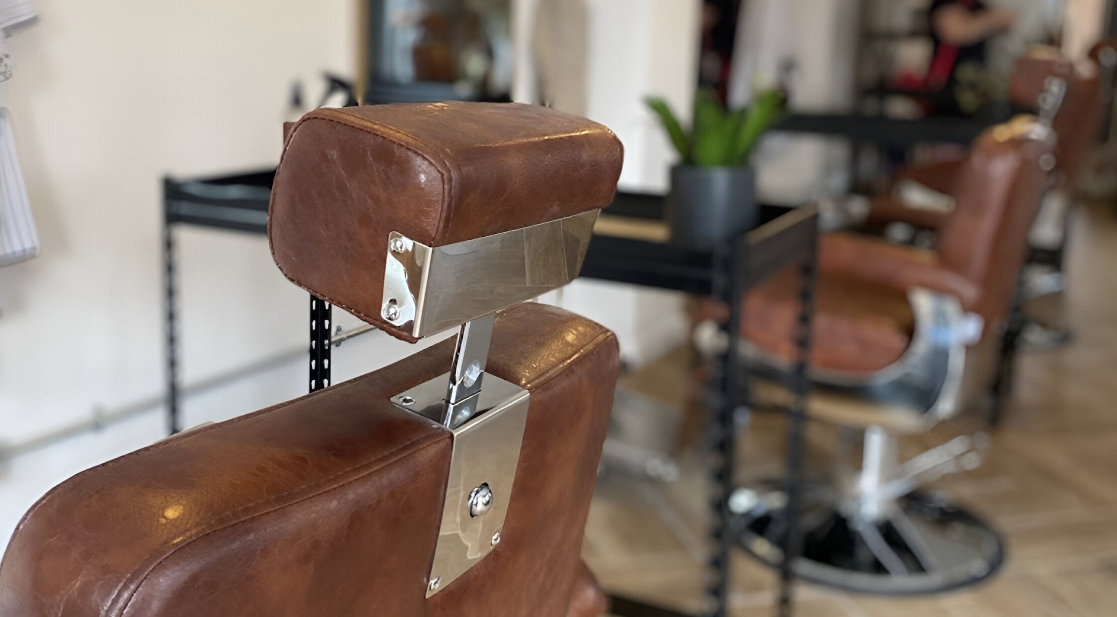 Comfortable leather barber chair at GUEST salon, Portsmouth, England, GB, offering premium grooming services.