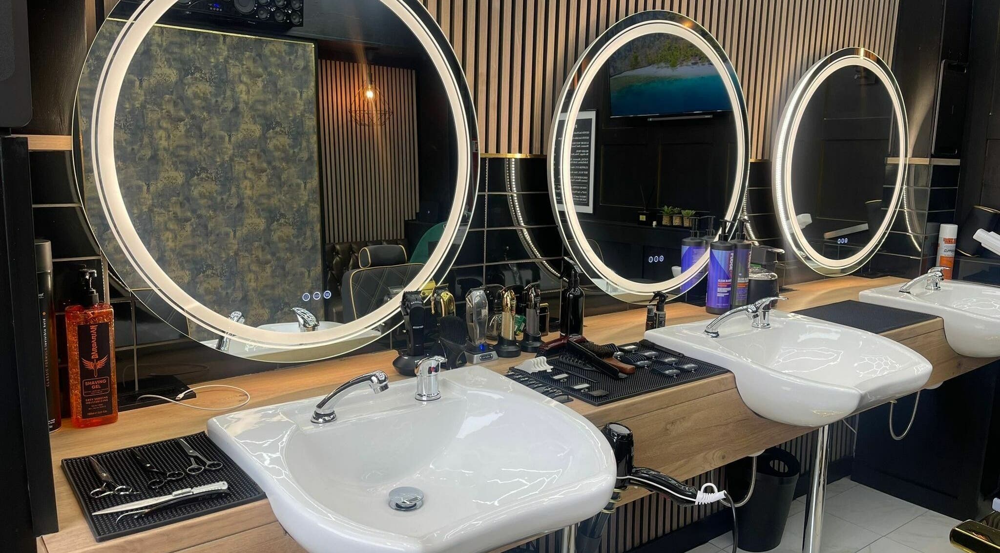Modern styling area with illuminated mirrors at Chopafellas, Wickford, England, GB.