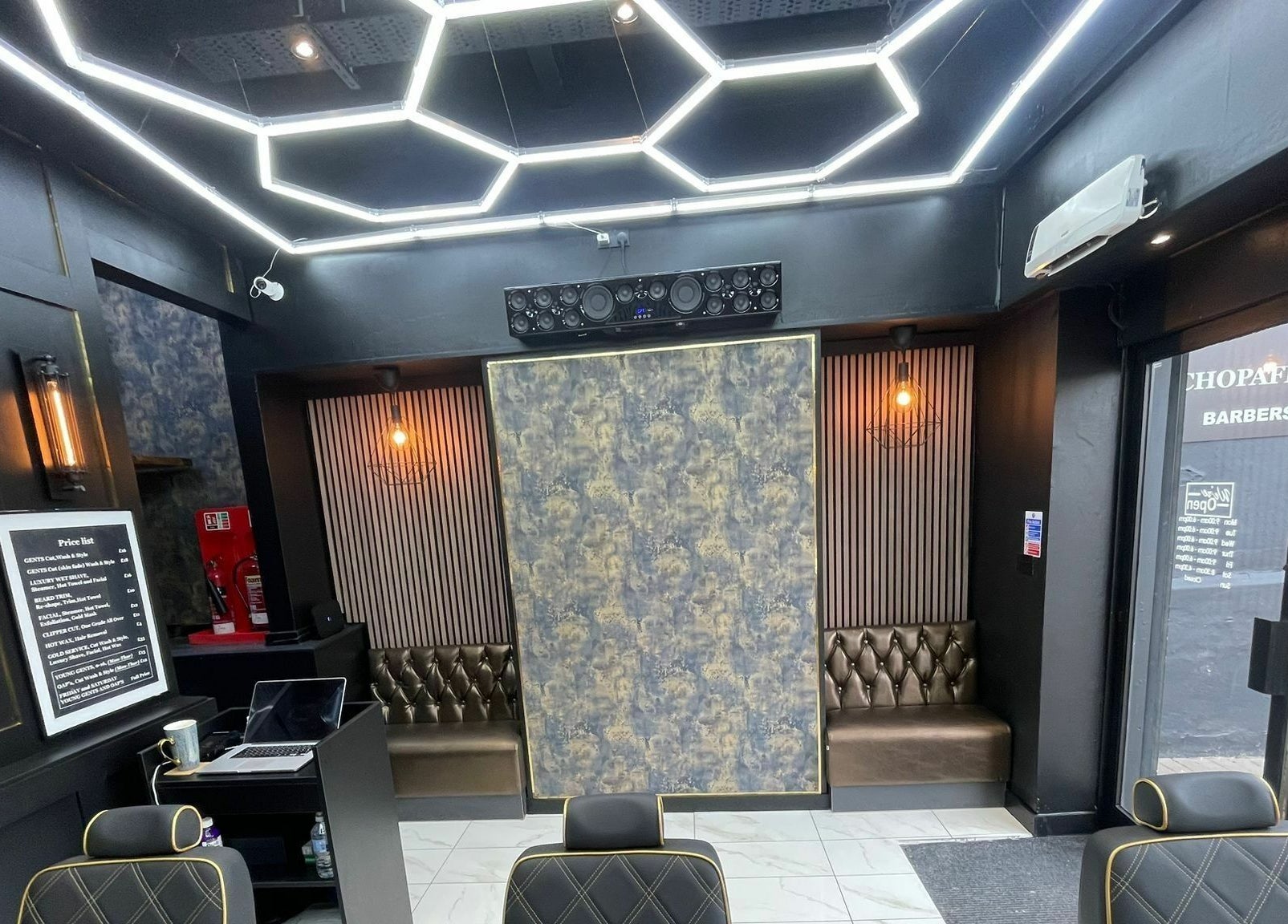 Modern interior of Chopafellas in Wickford, England, showcasing stylish seating and lighting.