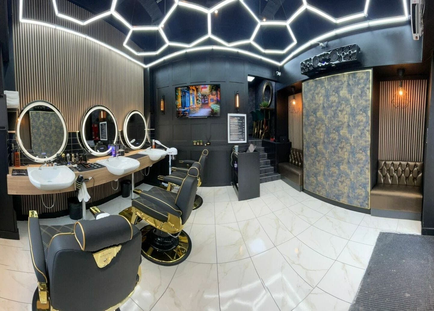 Modern interior of Chopafellas in Wickford, England, GB, showcasing luxury barber chairs and stylish decor.