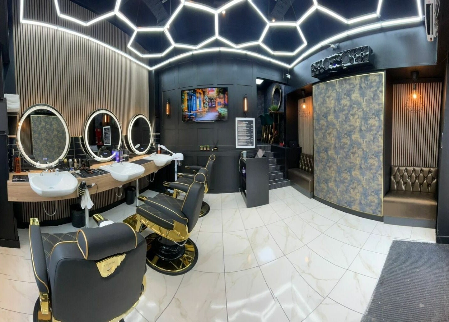 Modern interior of Chopafellas in Wickford, England, GB, showcasing luxury barber chairs and stylish decor.