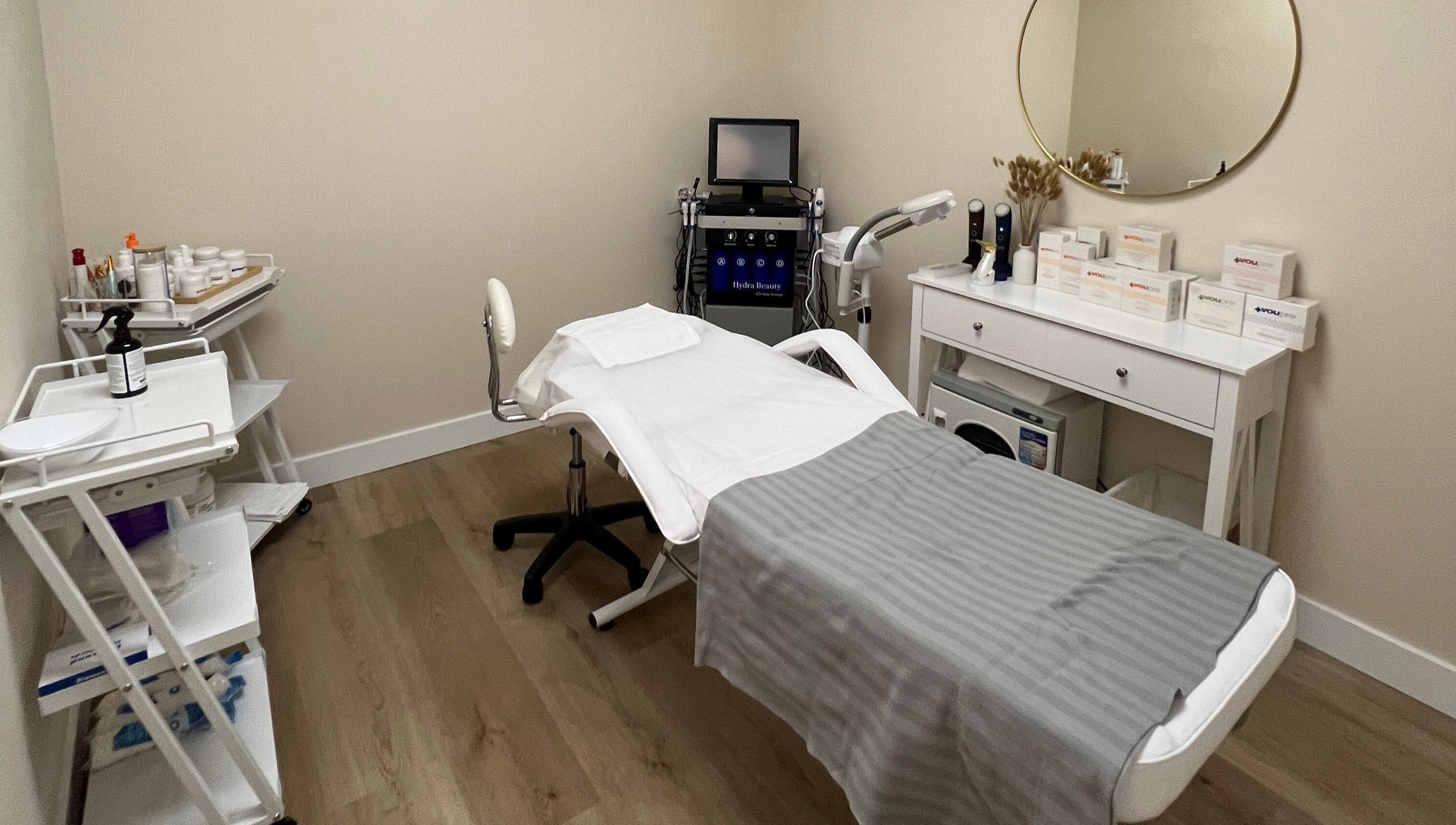 Relaxing treatment room at Oasis Aesthetics Spa - Henderson in Winnipeg, Manitoba, CA with modern equipment.