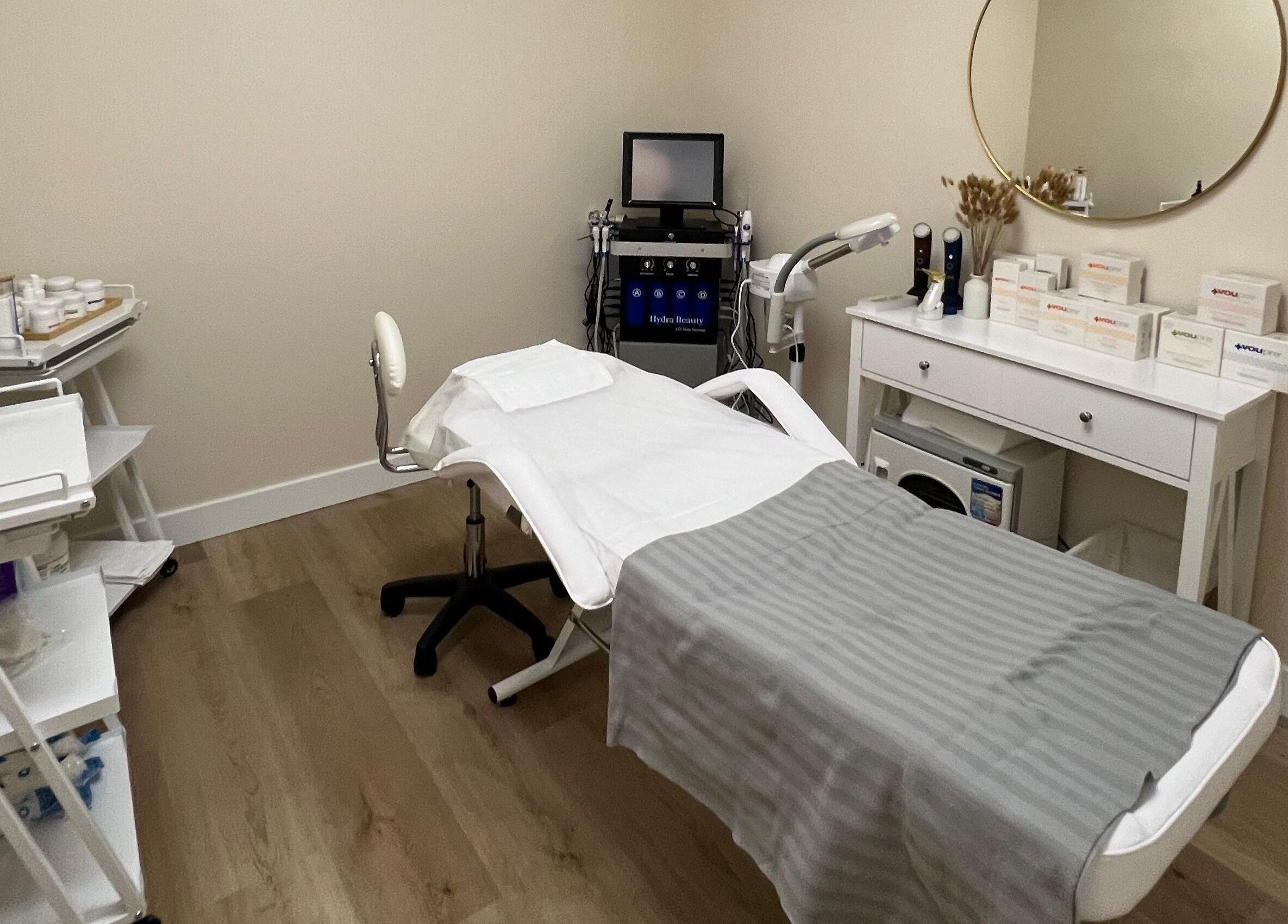 Relaxing treatment room at Oasis Aesthetics Spa - Henderson in Winnipeg, Manitoba, CA with modern equipment.