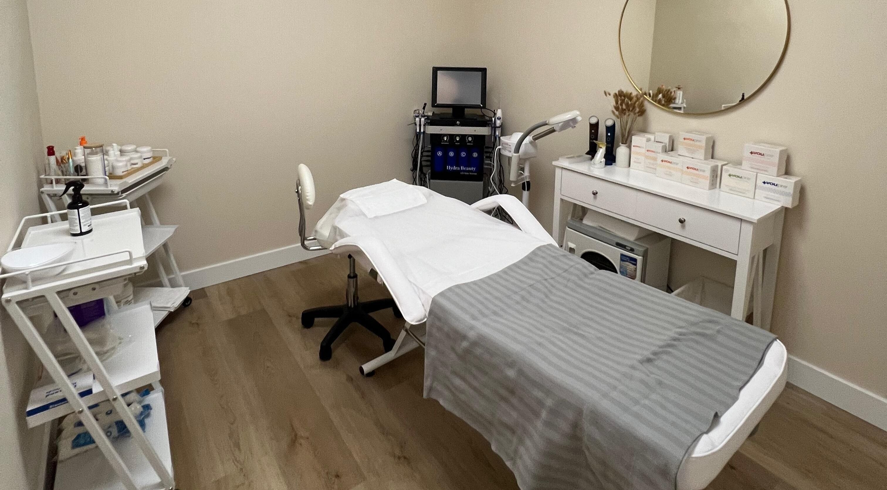 Relaxing treatment room at Oasis Aesthetics Spa - Henderson in Winnipeg, Manitoba, CA with modern equipment.