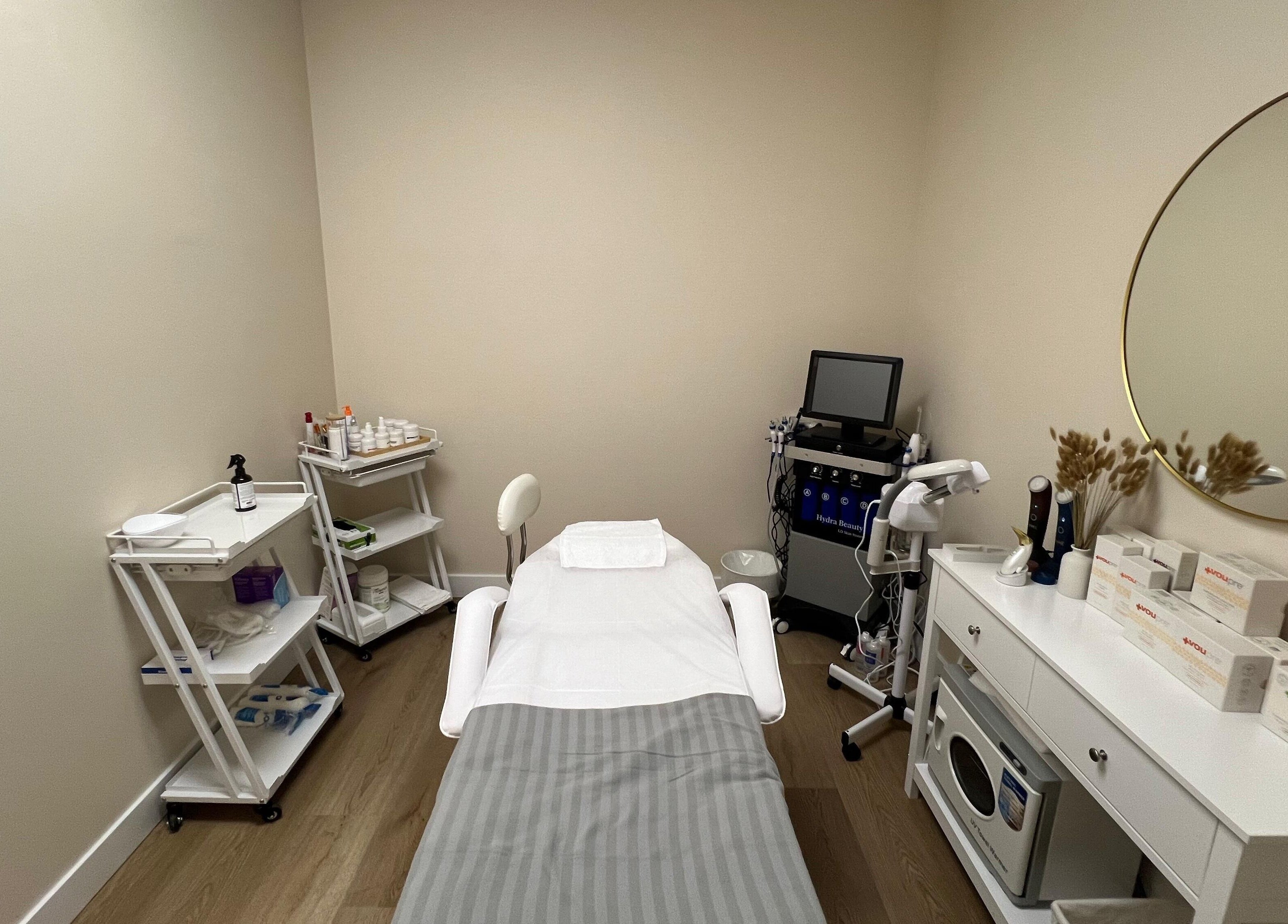Serene treatment room at Oasis Aesthetics Spa - Henderson in Winnipeg, Manitoba, CA with modern equipment.