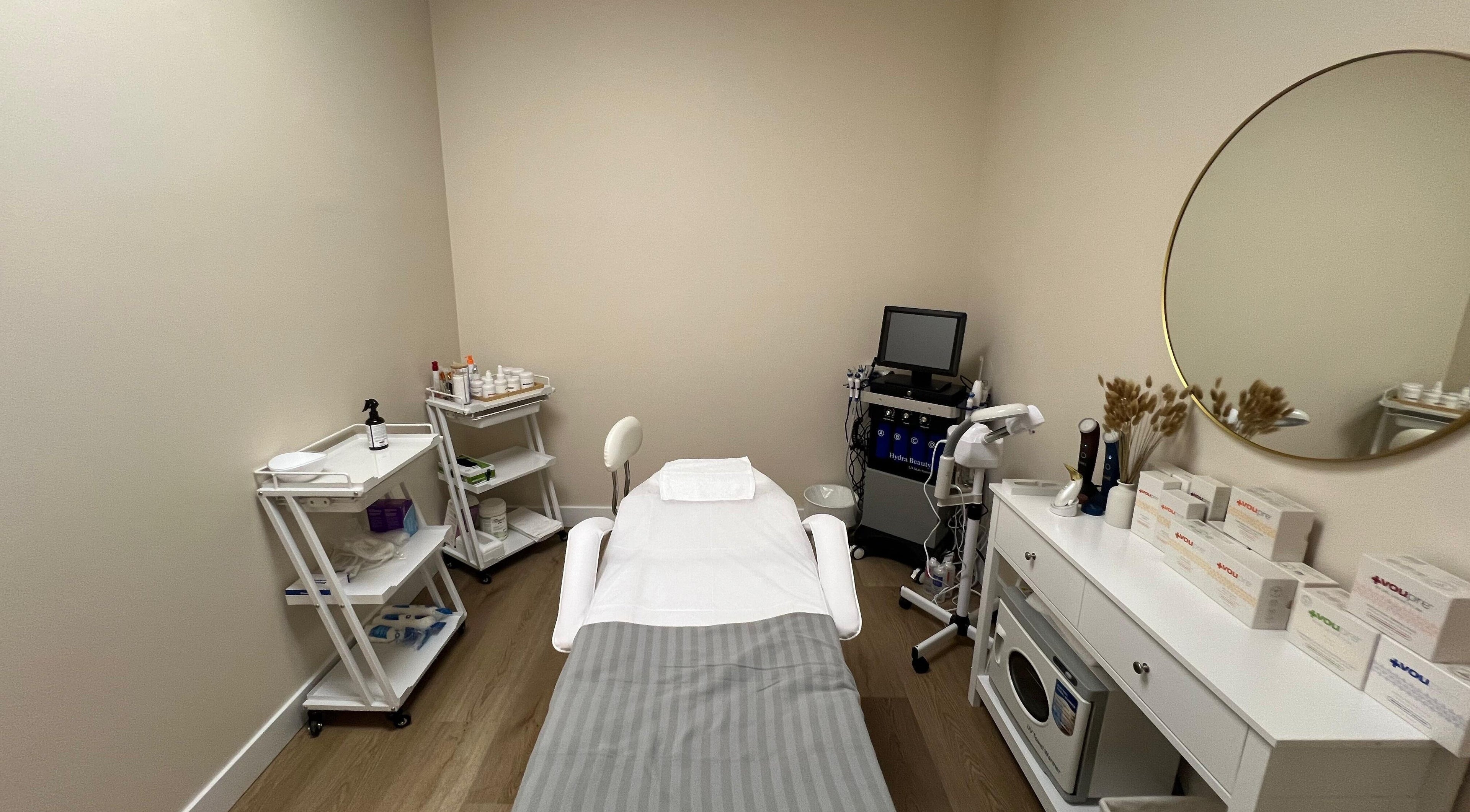 Serene treatment room at Oasis Aesthetics Spa - Henderson in Winnipeg, Manitoba, CA with modern equipment.