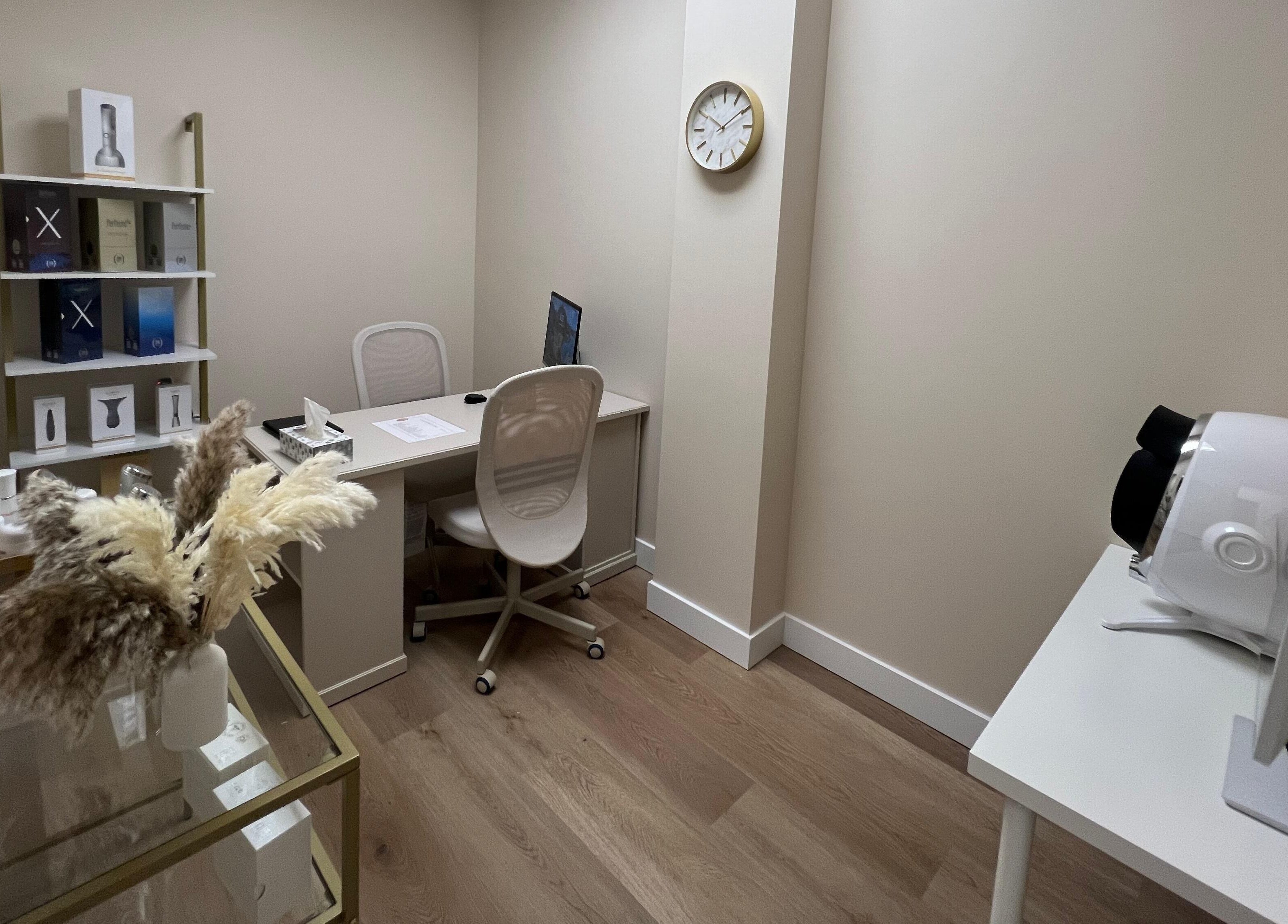 Cozy office at Oasis Aesthetics Spa - Henderson, Winnipeg, Manitoba, CA with decor and modern amenities.