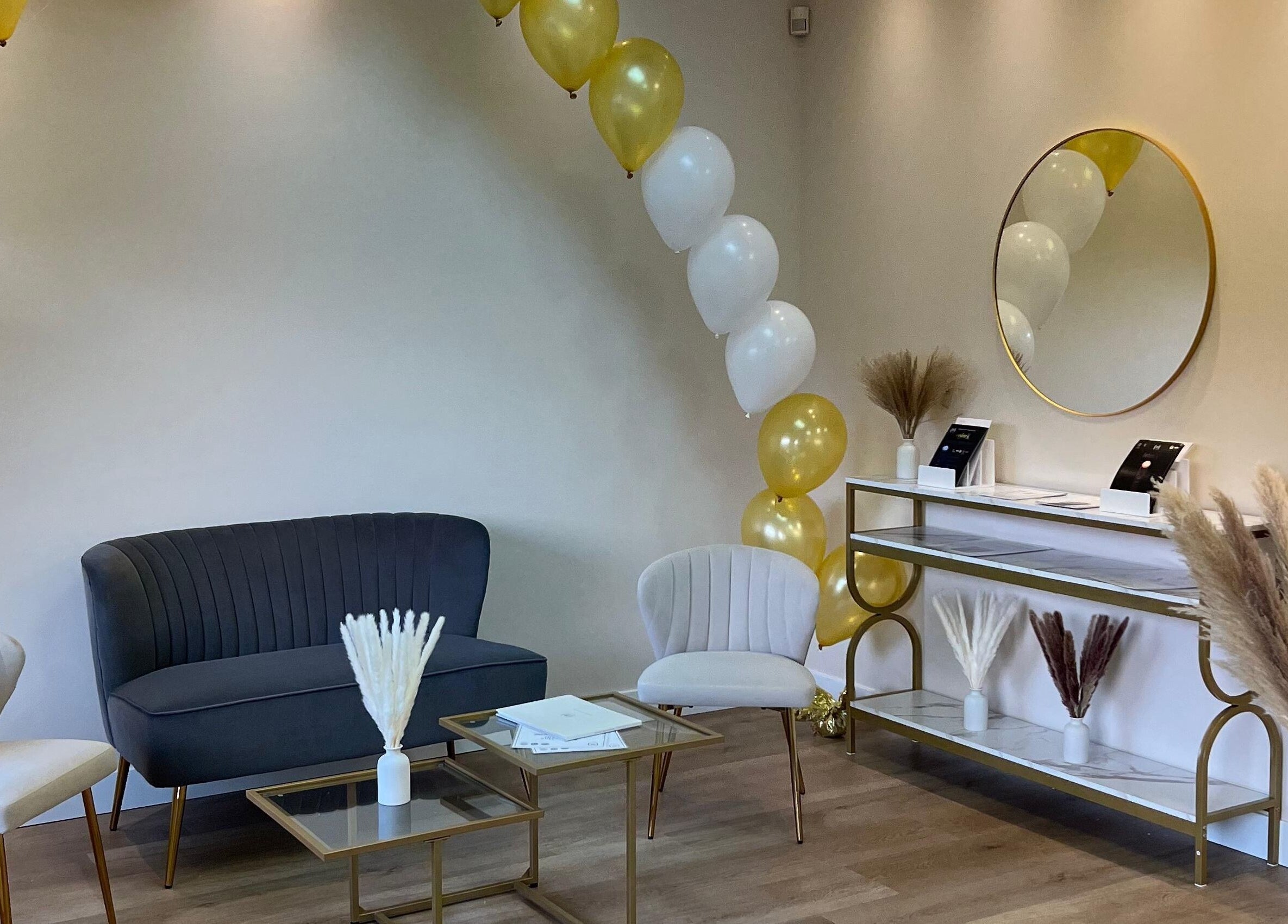 Chic reception area at Oasis Aesthetics Spa - Henderson, Winnipeg, Manitoba, CA, with stylish seating and decor.