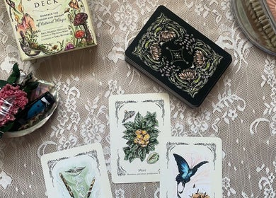 Tarot cards and mystical items at Indigo Wellness, Falmouth, England, GB on a delicate lace table.