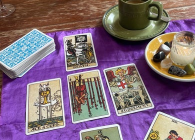 Tarot reading setup at Indigo Wellness, Falmouth, England, GB, featuring cards and healing crystals.