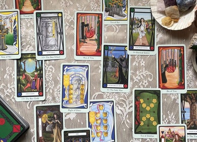 Tarot card layout at Indigo Wellness in Falmouth, England, GB on a lace tablecloth enhances the mystical ambiance.
