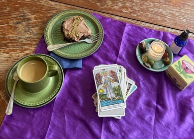 Relaxing tarot and tea set at Indigo Wellness, Falmouth, England, GB, showcasing tranquility and holistic vibes.