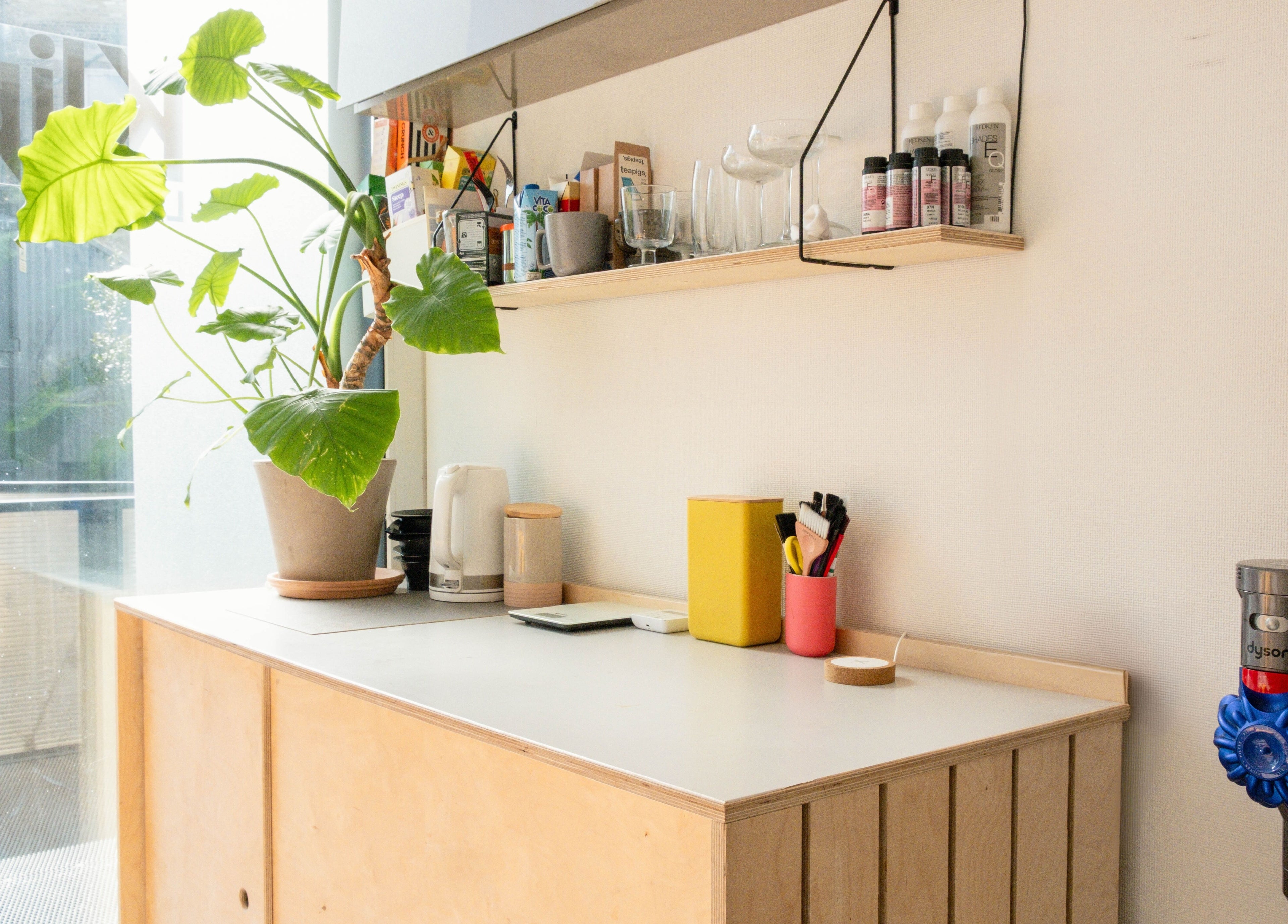 Bright workspace with plant and tools at Klip London, London, England, GB, enhancing a calm ambiance.