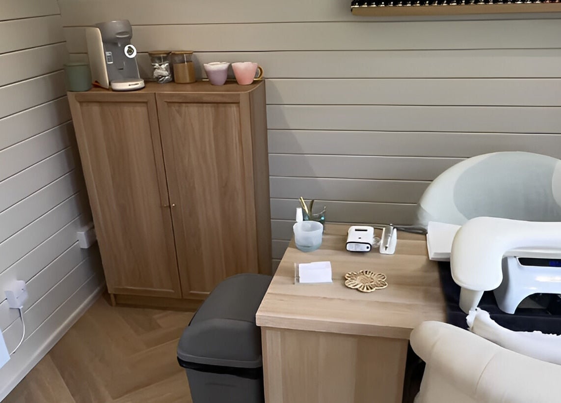 Modern treatment nook at Bellisamani in Rickmansworth, England, GB, features sleek furniture and wellness decor.