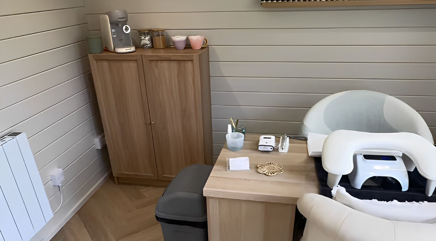 Modern treatment nook at Bellisamani in Rickmansworth, England, GB, features sleek furniture and wellness decor.