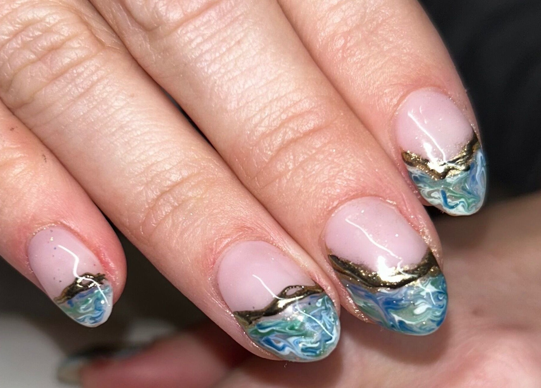 Intricate ocean-themed nail art at Bellisamani, Rickmansworth, England, GB.