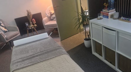 Relaxify Massage Therapy room in Clondalkin, IE, featuring a cozy chair and massage table for ultimate relaxation.