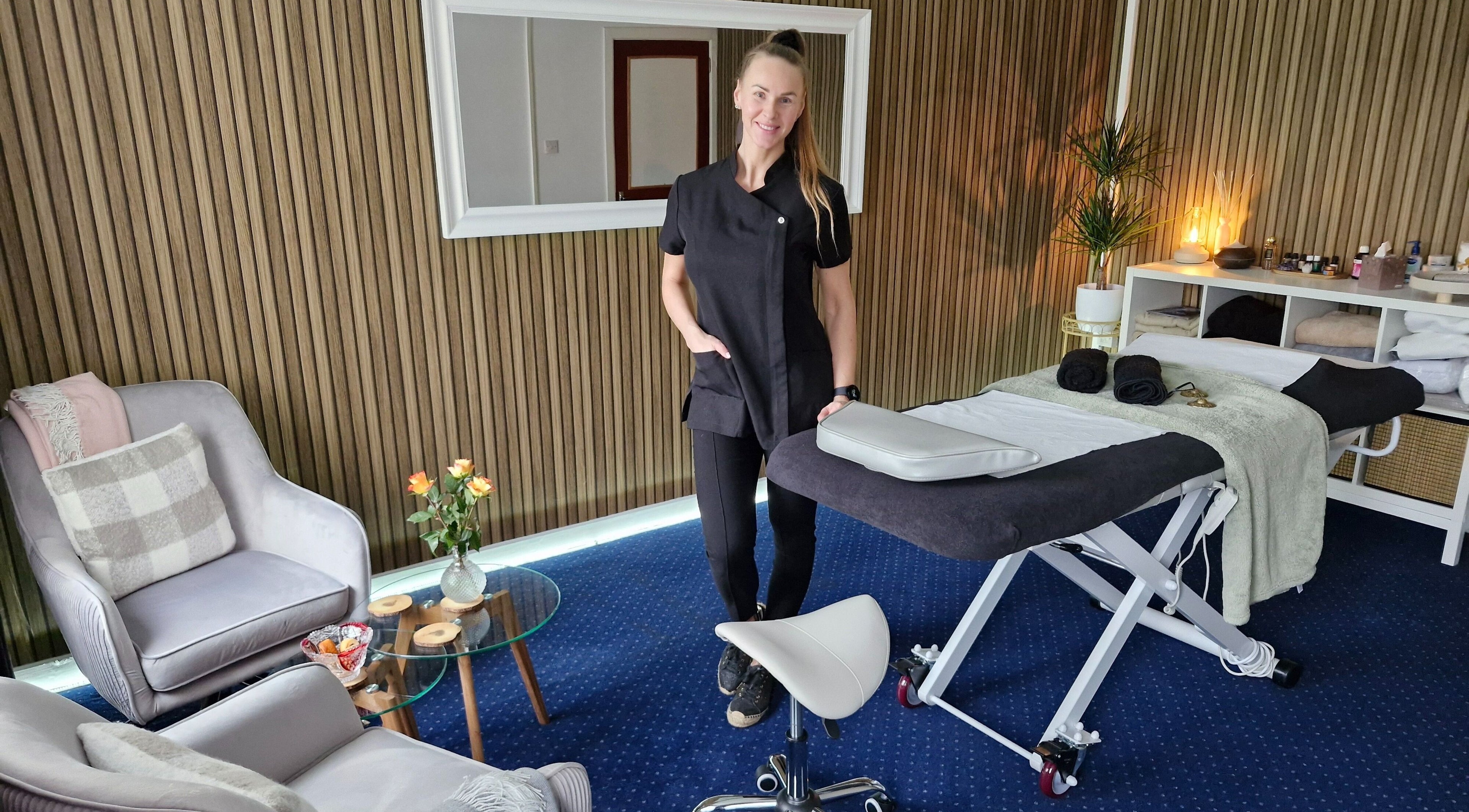 Relaxify Massage Therapy in Clondalkin, IE, showcasing a serene massage room with a welcoming therapist.