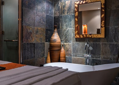 Luxurious spa room at SENSASIA - The Village, Dubai, Dubai, AE featuring a soaking tub and elegant decor.