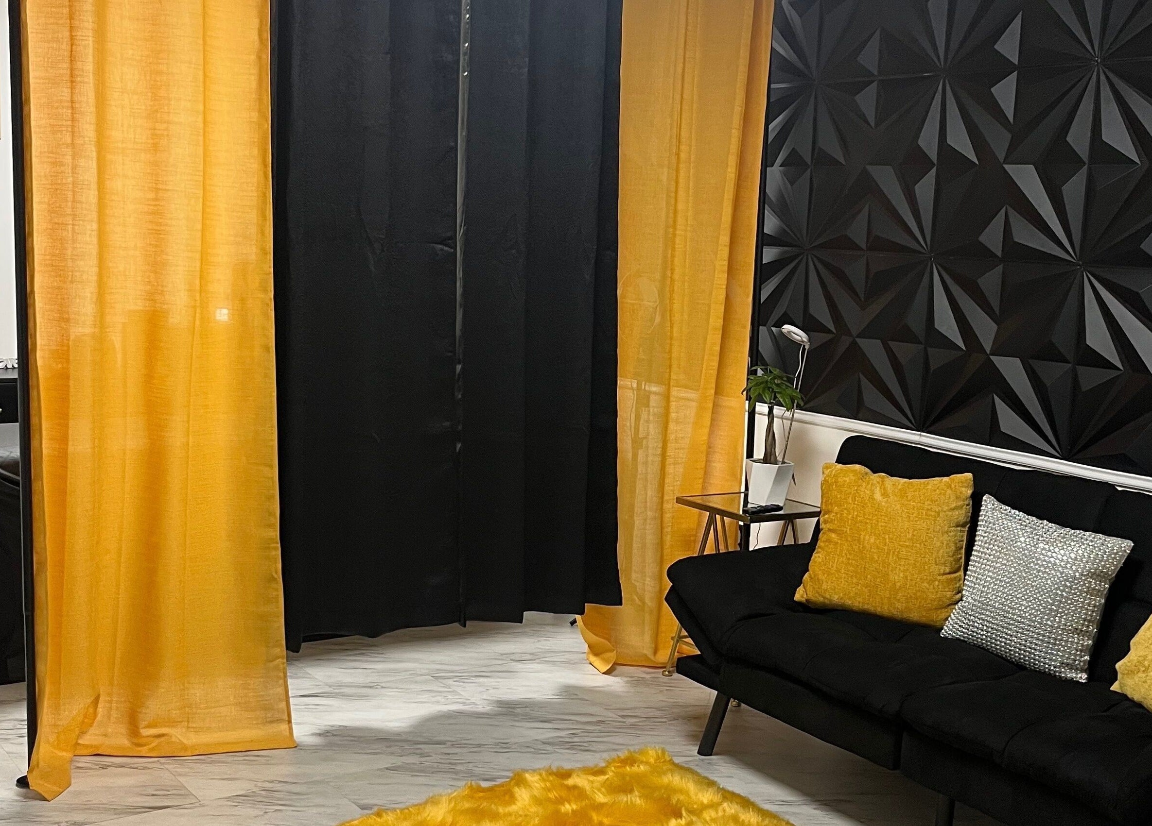 Elegant and cozy interior of Niosha Body Bar, Torrance, California, US with black and gold decor.