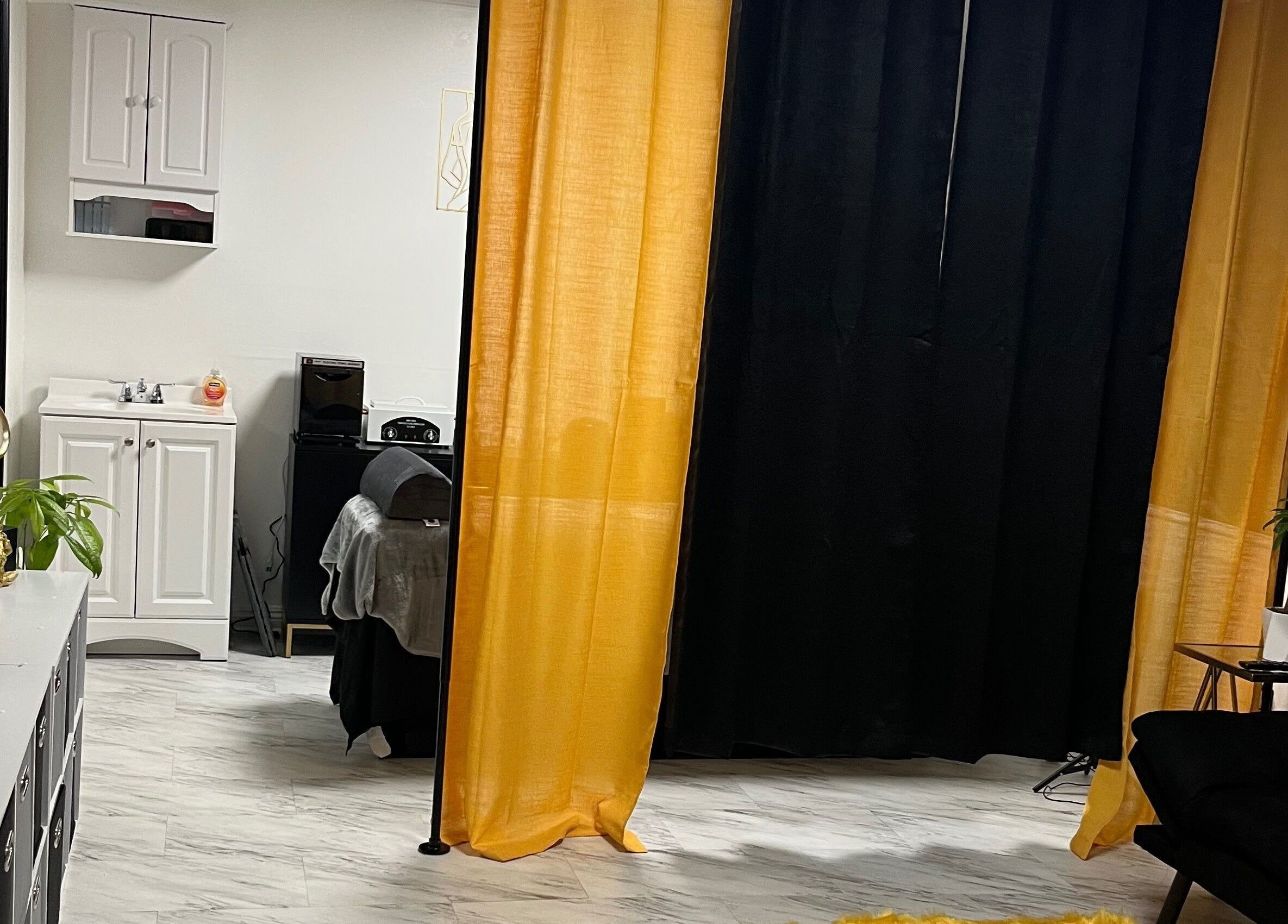 Luxurious treatment room at Niosha Body Bar, Torrance, California, US, with modern decor and soothing ambiance.