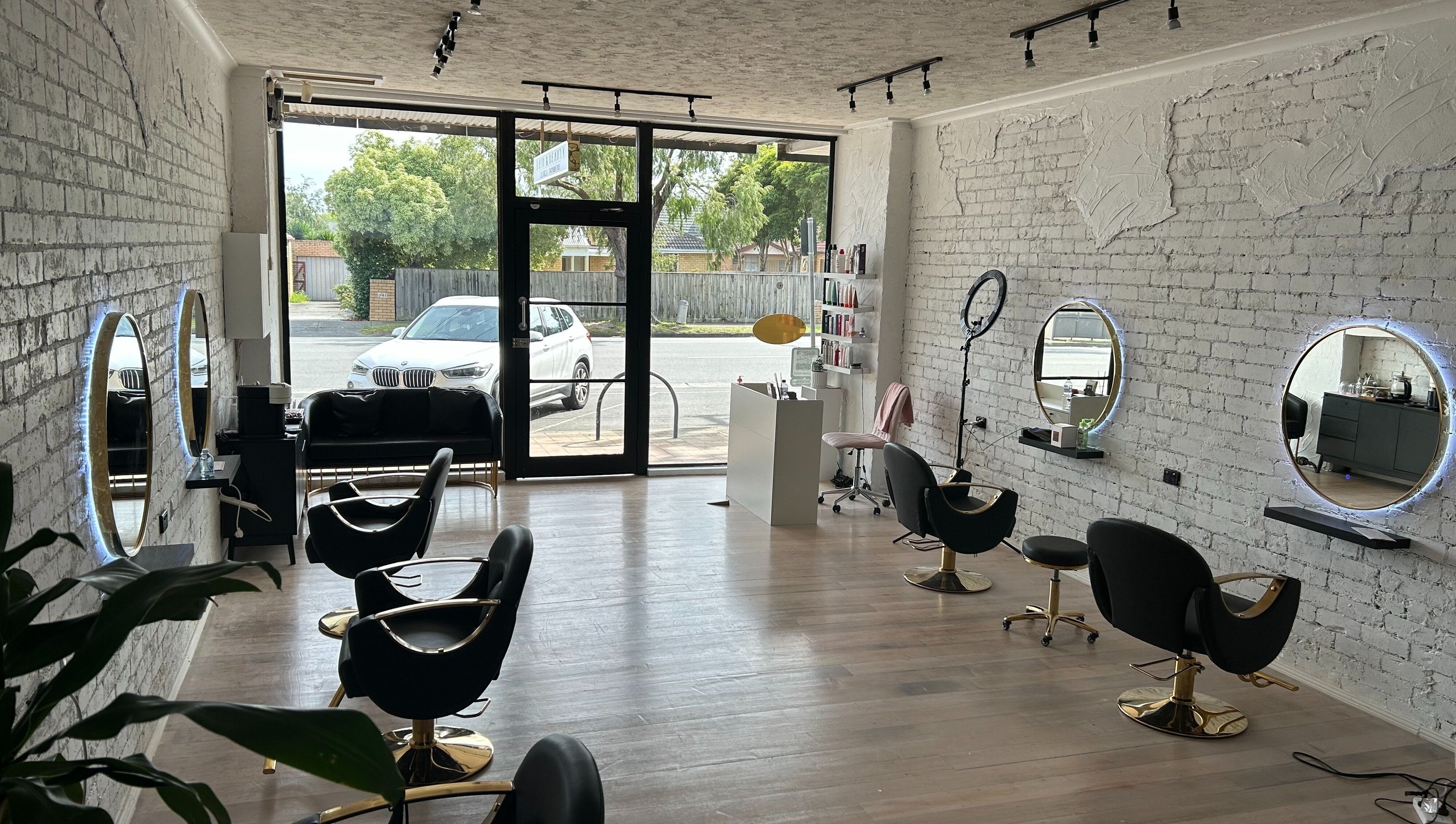 Interior of Gleam Up Beauty in Glen Waverley, Victoria, AU with modern styling chairs and mirrors.