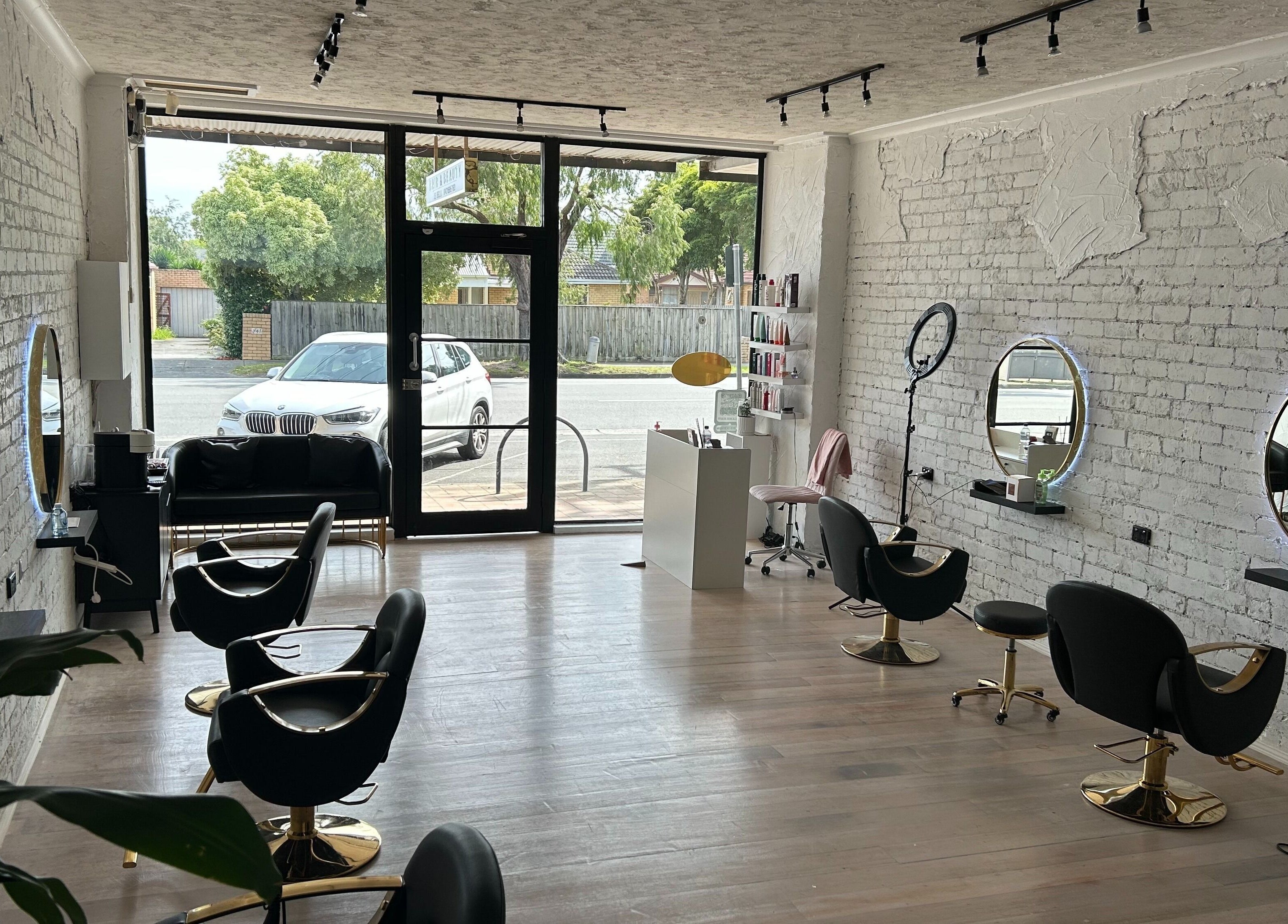 Interior of Gleam Up Beauty in Glen Waverley, Victoria, AU with modern styling chairs and mirrors.