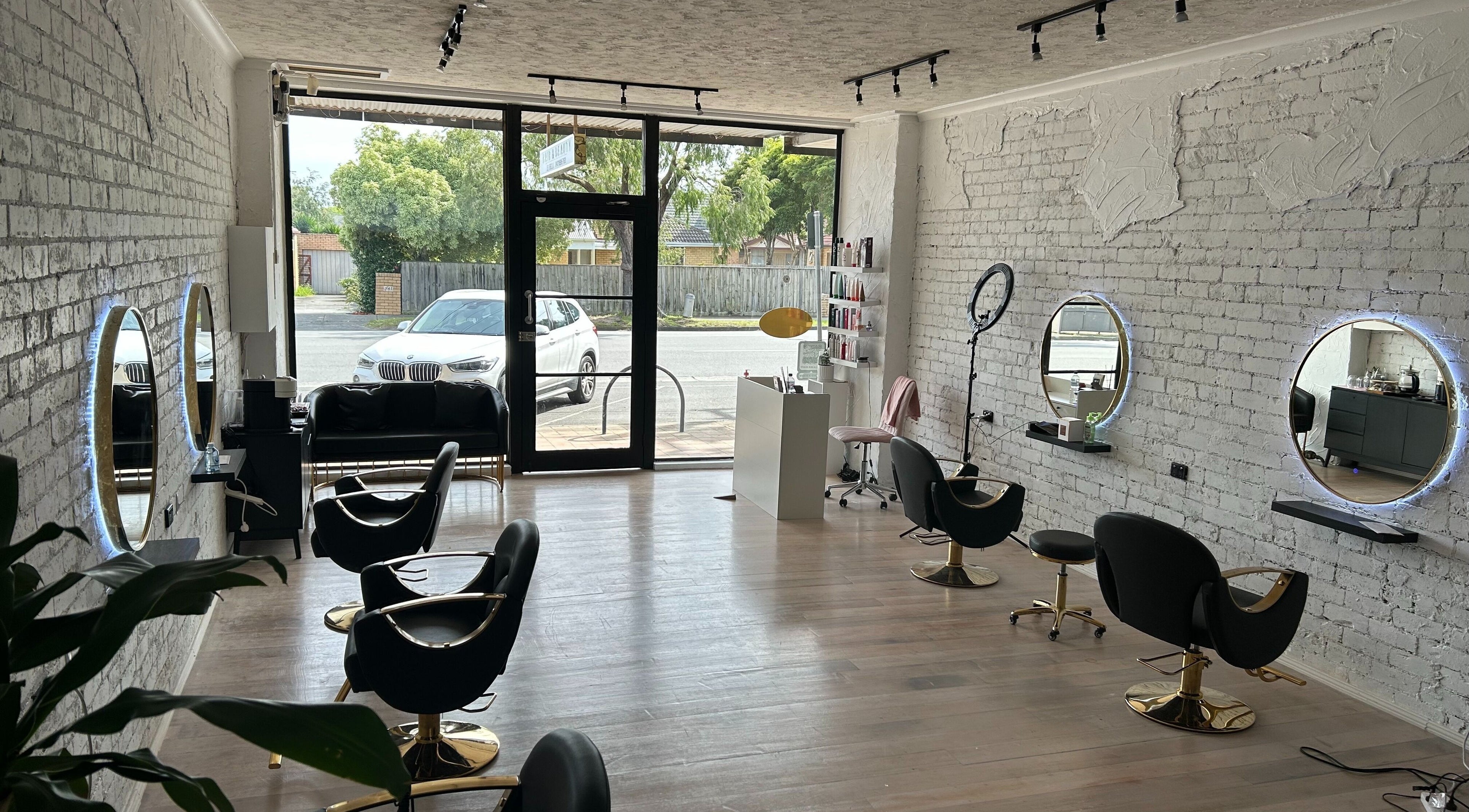 Interior of Gleam Up Beauty in Glen Waverley, Victoria, AU with modern styling chairs and mirrors.