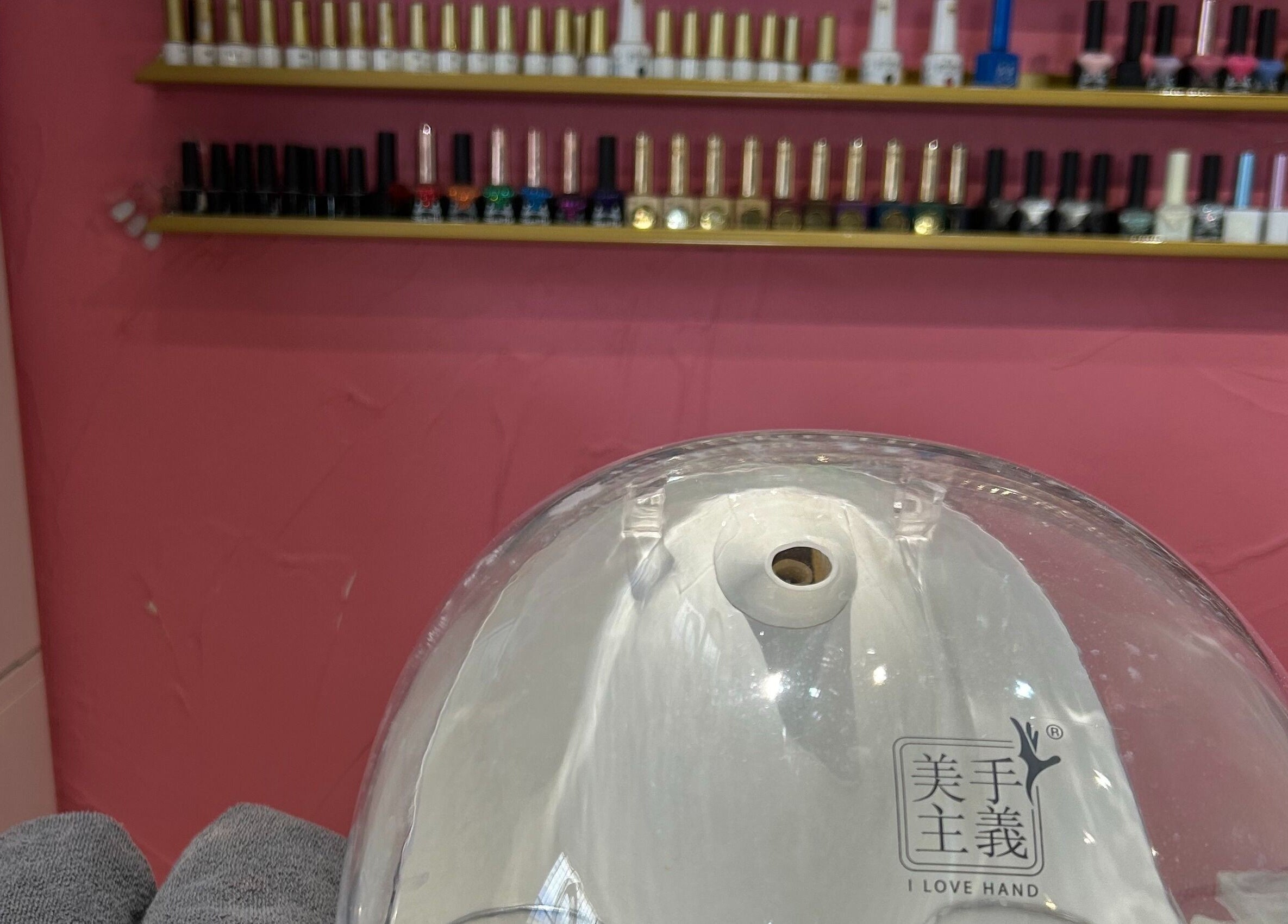 Nail polish display at Gleam Up Beauty, Glen Waverley, Victoria, AU with manicure station in focus.