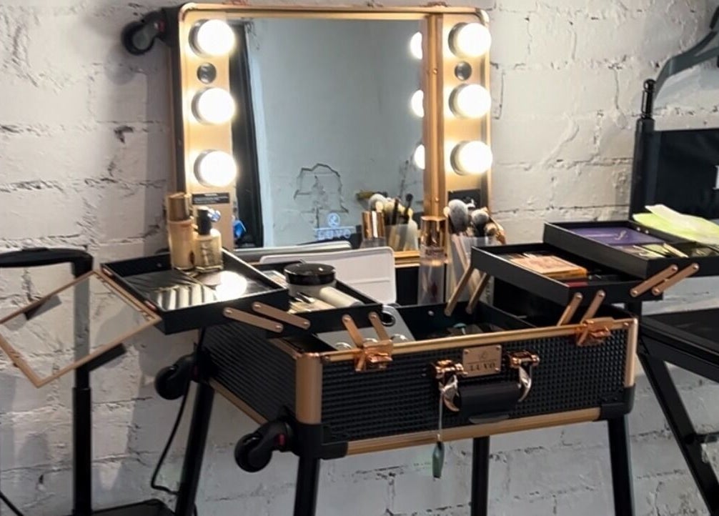 Elegant makeup station at Gleam Up Beauty, Glen Waverley, Victoria, AU, with lighted mirror and products.