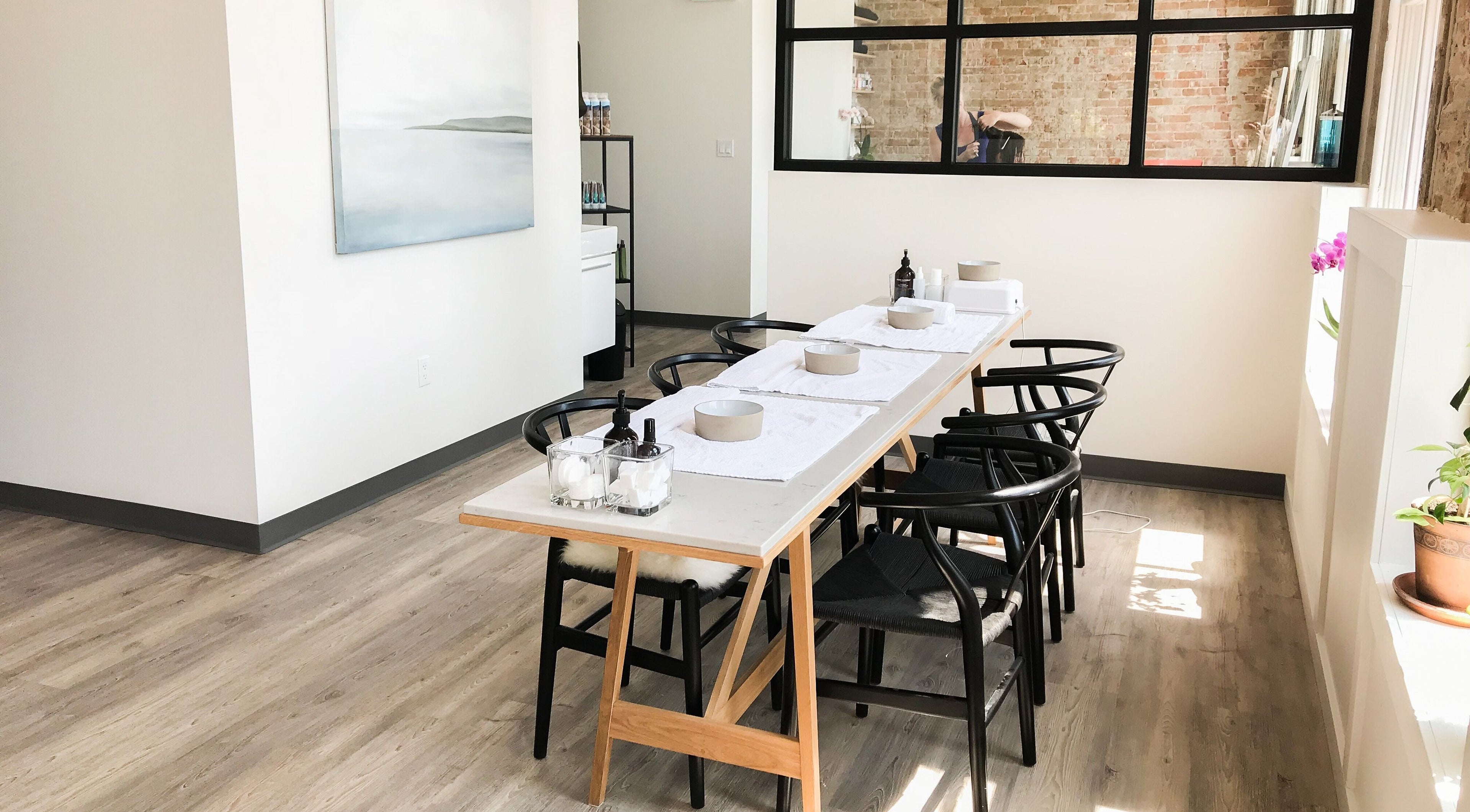 Elegant spa treatment table at The Refinery Spa + Social House in Kingston, Ontario, CA with natural lighting.