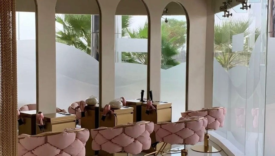 Elegant pink seating and styling stations inside HOME SERVICE - PINK PLASTIC SALON, Dubai, Dubai, AE.