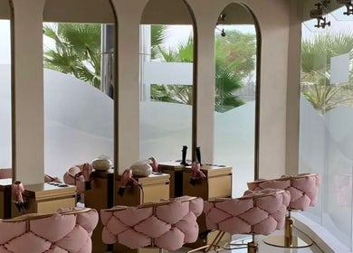Elegant pink seating and styling stations inside HOME SERVICE - PINK PLASTIC SALON, Dubai, Dubai, AE.