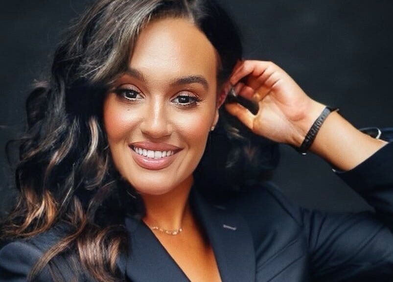 Smiling individual in stylish attire at SA Artistry, Arklow, County Wicklow, IE showcasing beauty and confidence.